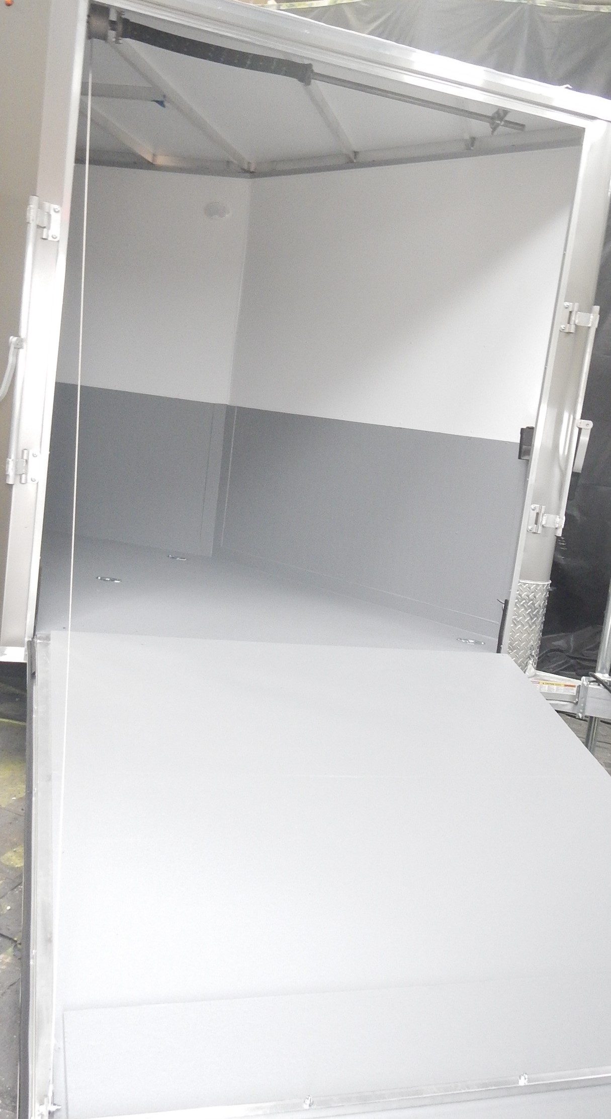 RV coach waterproofed with seamless polyurea membrane